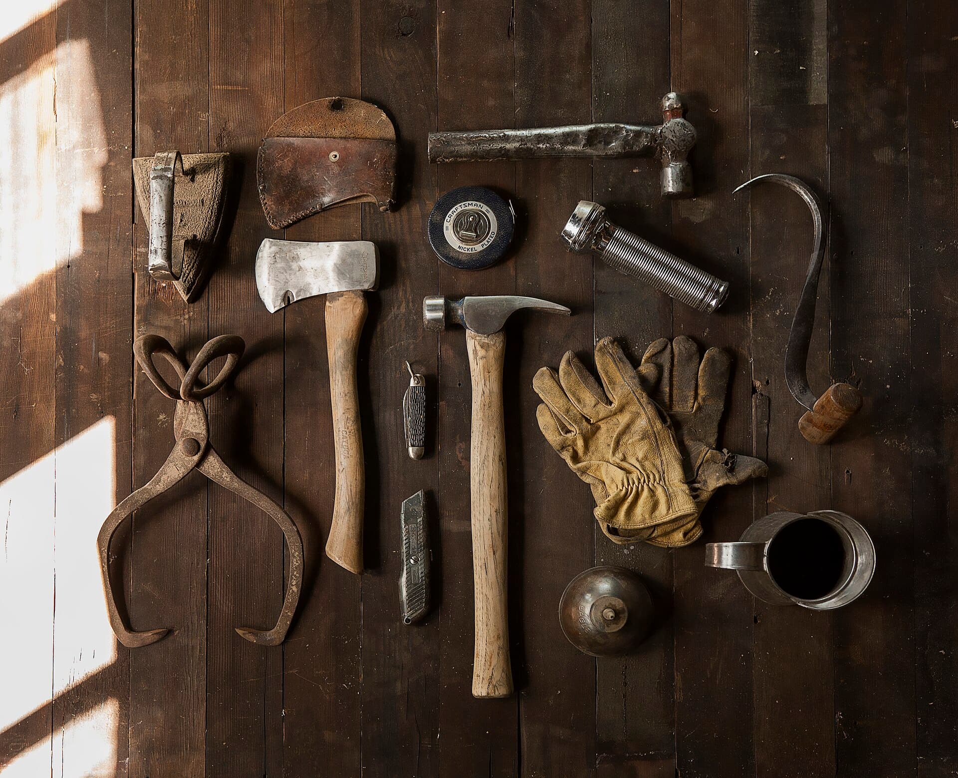 Carpenter tools laid out on a timber workbench