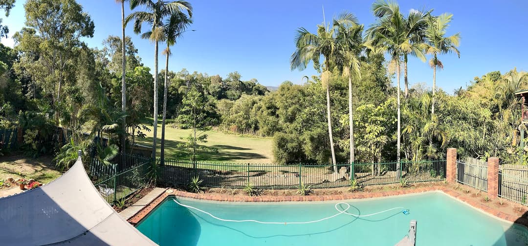 The backyard and swimming pool of a house in Corinda, Queensland - pano